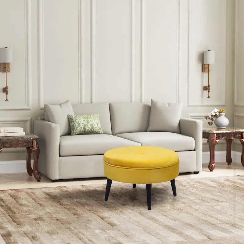 Pouf rond en tissu capitonné