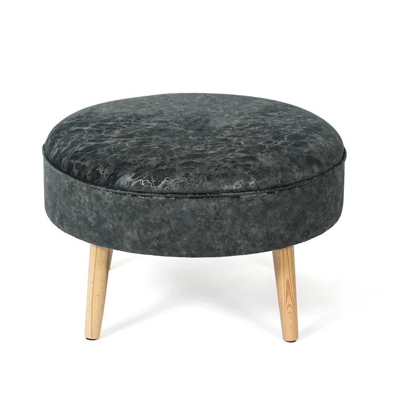 Pouf rond en tissu capitonné