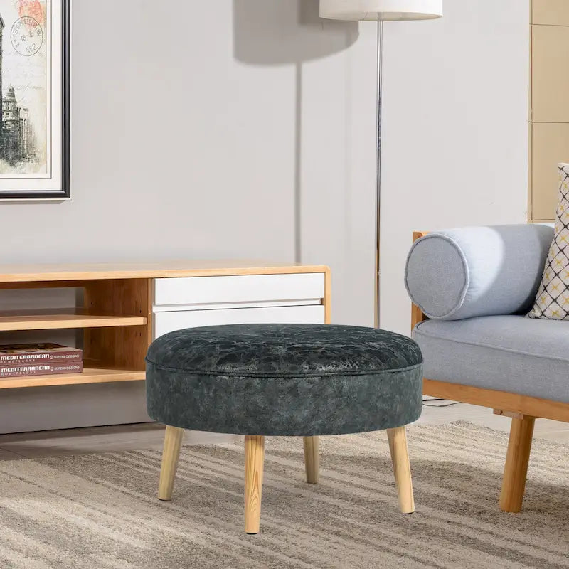 Pouf rond en tissu capitonné