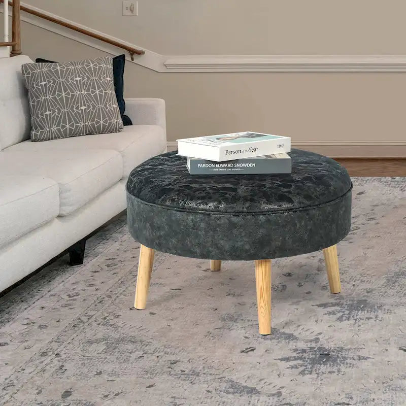 Pouf rond en tissu capitonné