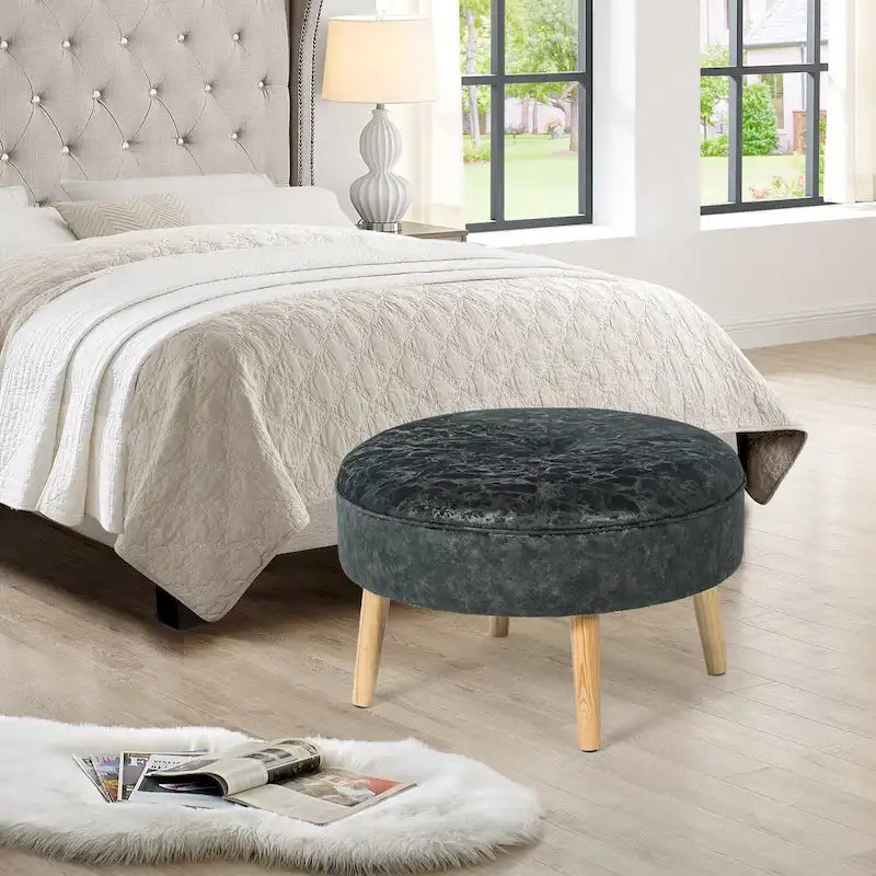 Pouf rond en tissu capitonné